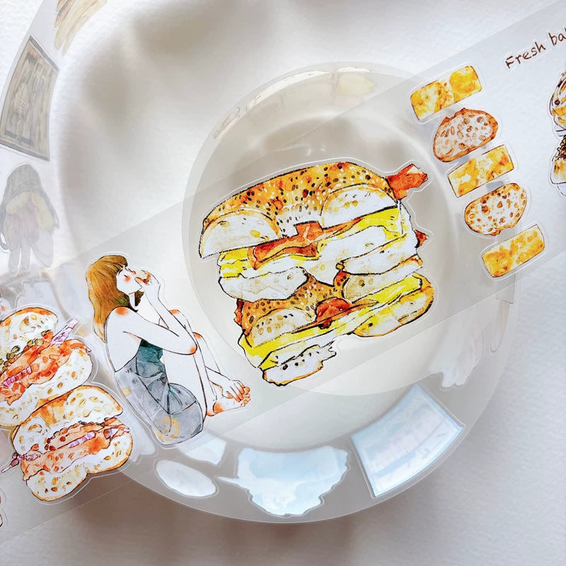 Close-up of die-cut bakery girls and bread tape