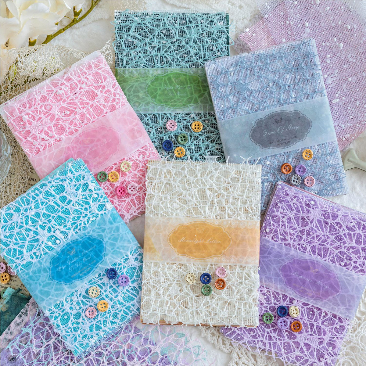 Mixed-texture pastel scrapbooking paper with romantic lace mesh overlay pattern