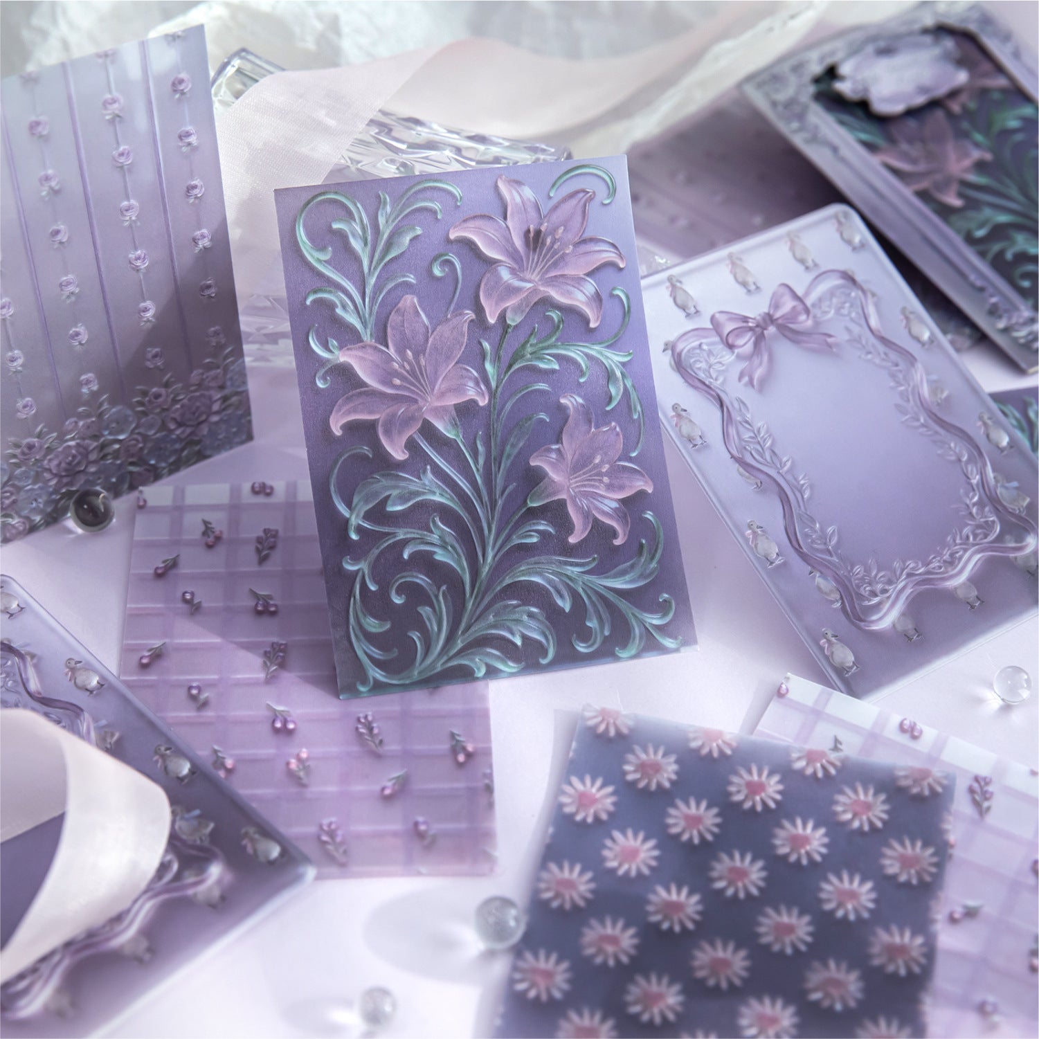 Embossed vellum scrapbooking paper with translucent decorative sheets