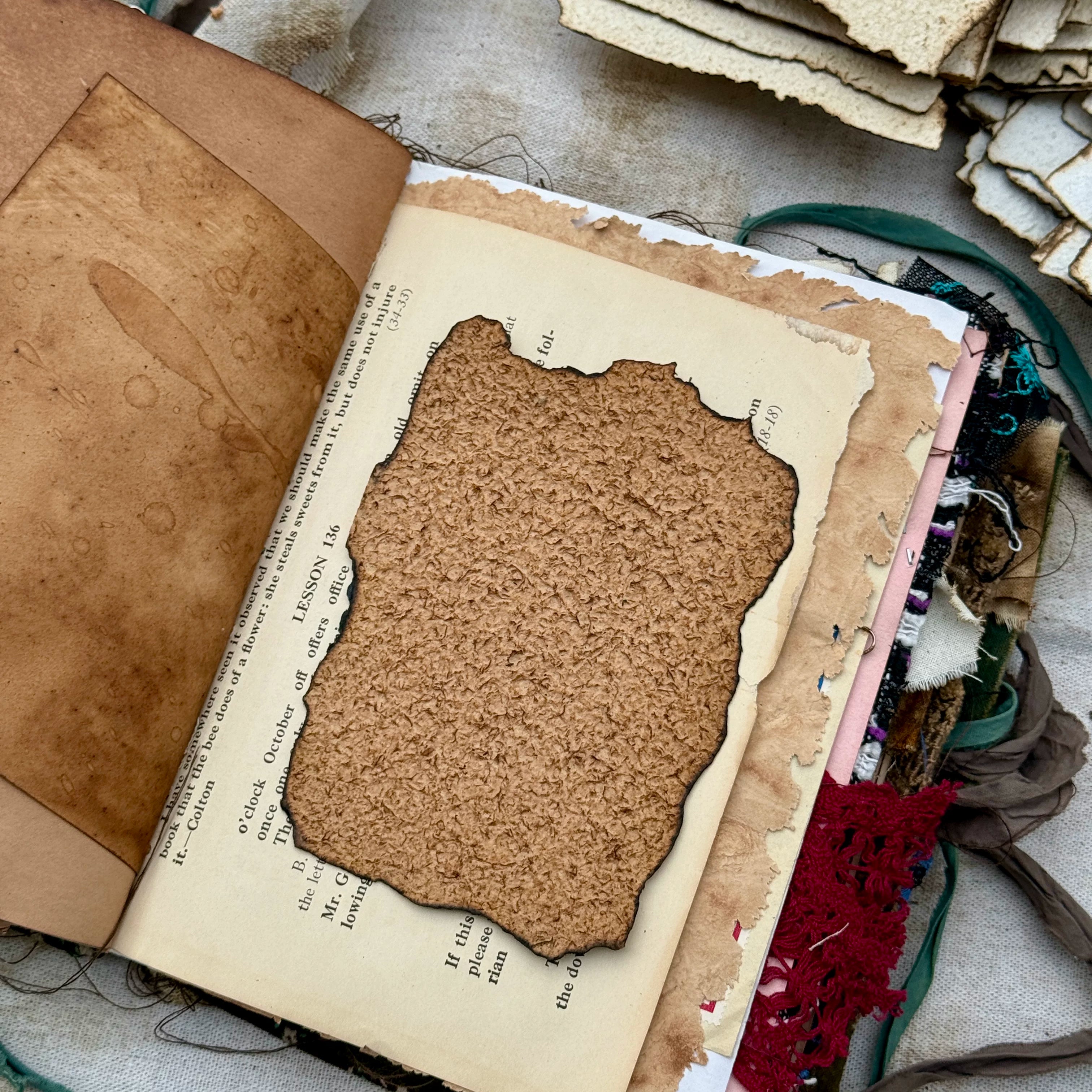 Vintage burnt edge handmade scrapbooking paper with aged neutral sheets
