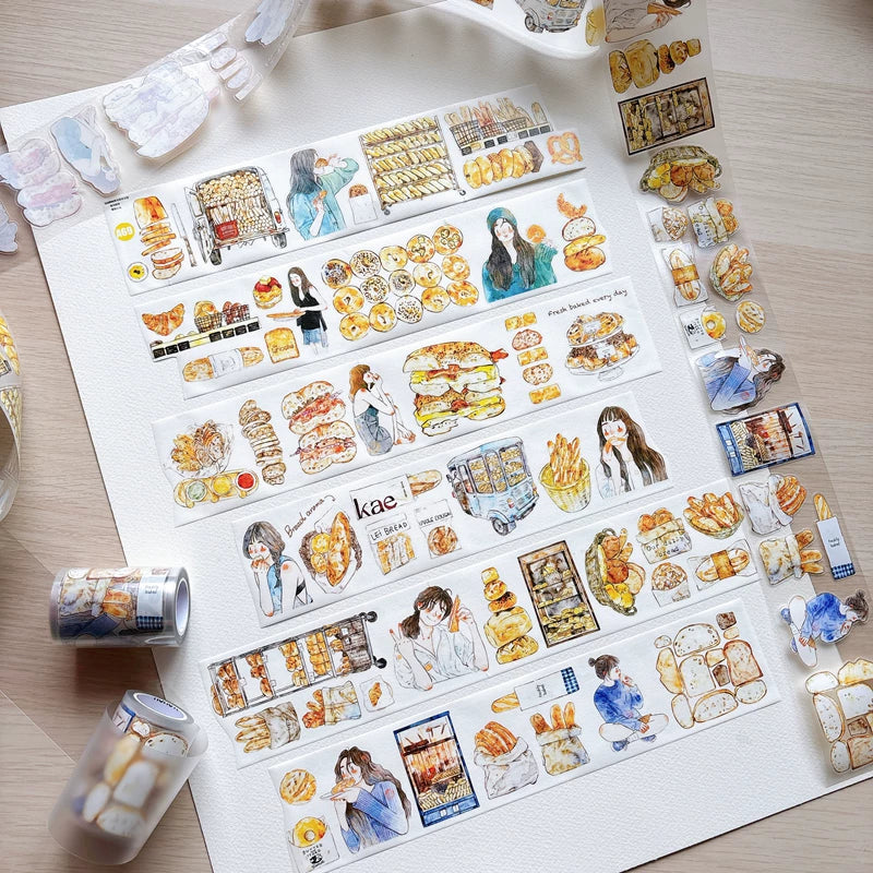 Bakery girl tape strips laid out on white paper with tape rolls