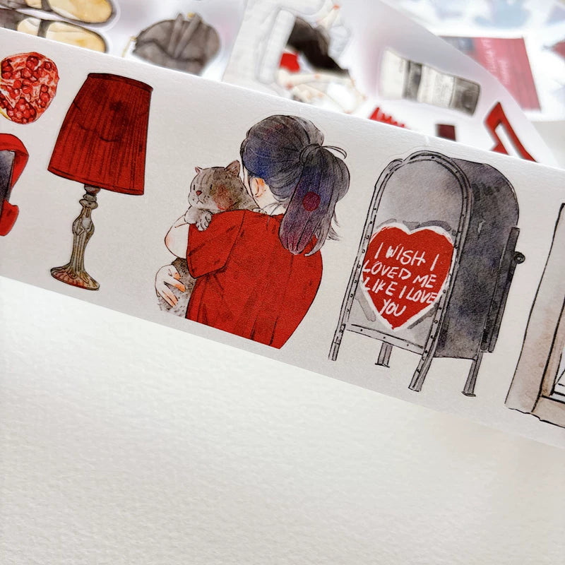 Close-up of die-cut red-themed girls and keepsakes tape