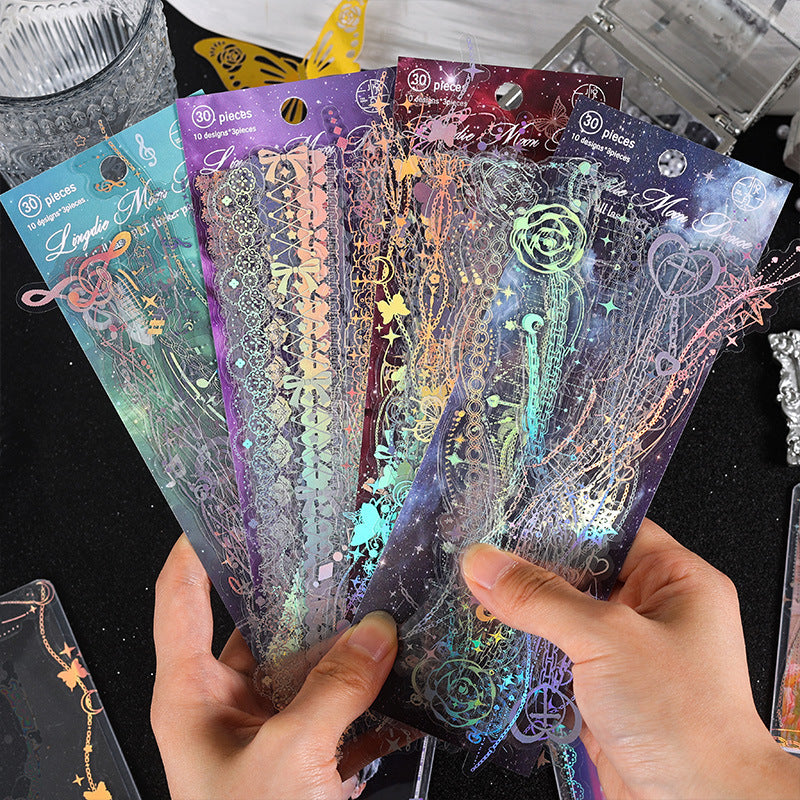 Dark holographic lace border sticker strips with color-shifting glow effect for night aesthetic journaling