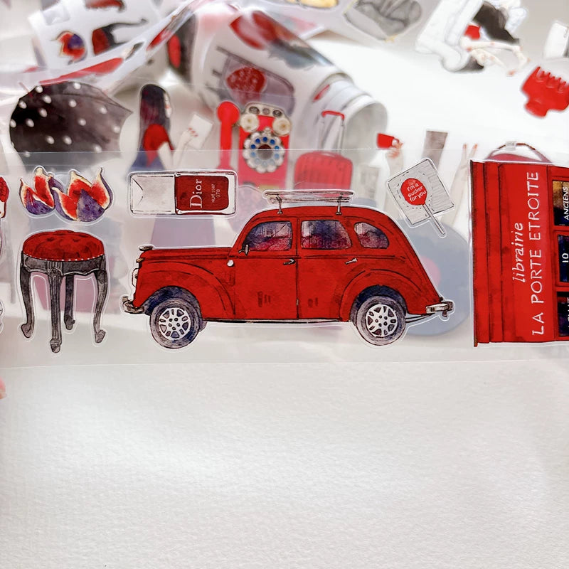 Close-up of die-cut red-themed girls and keepsakes tape