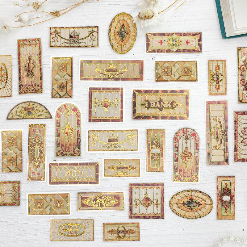 Vintage stained glass sticker layout with arched frames, decorative borders, oval panels, and floral glass pieces