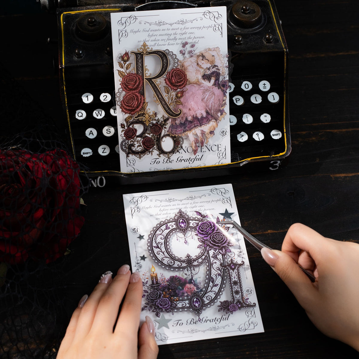 Hand holding gothic letter sticker packs
