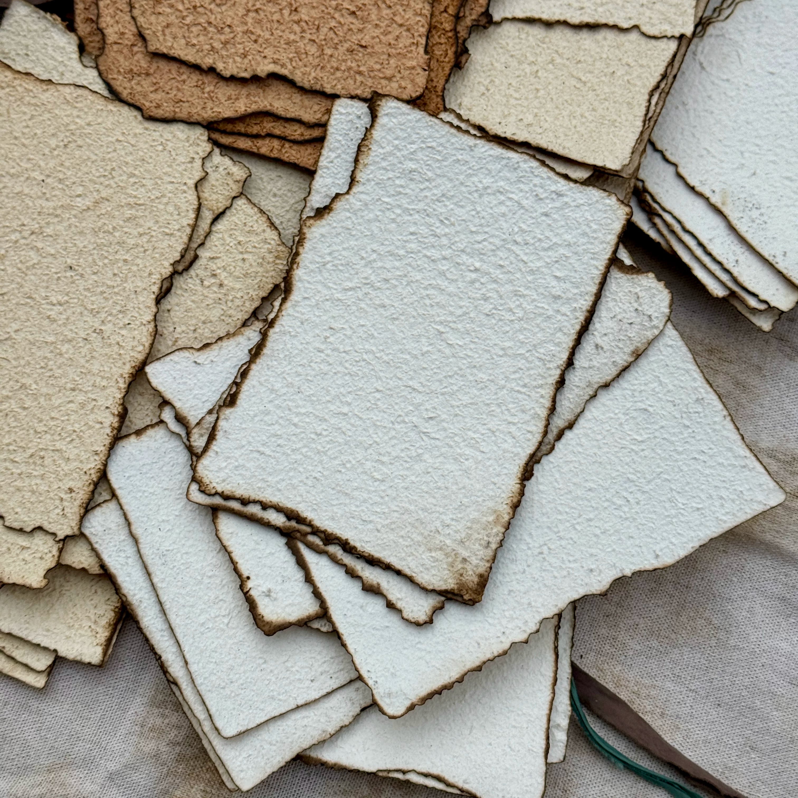 Vintage burnt edge handmade scrapbooking paper with aged neutral sheets