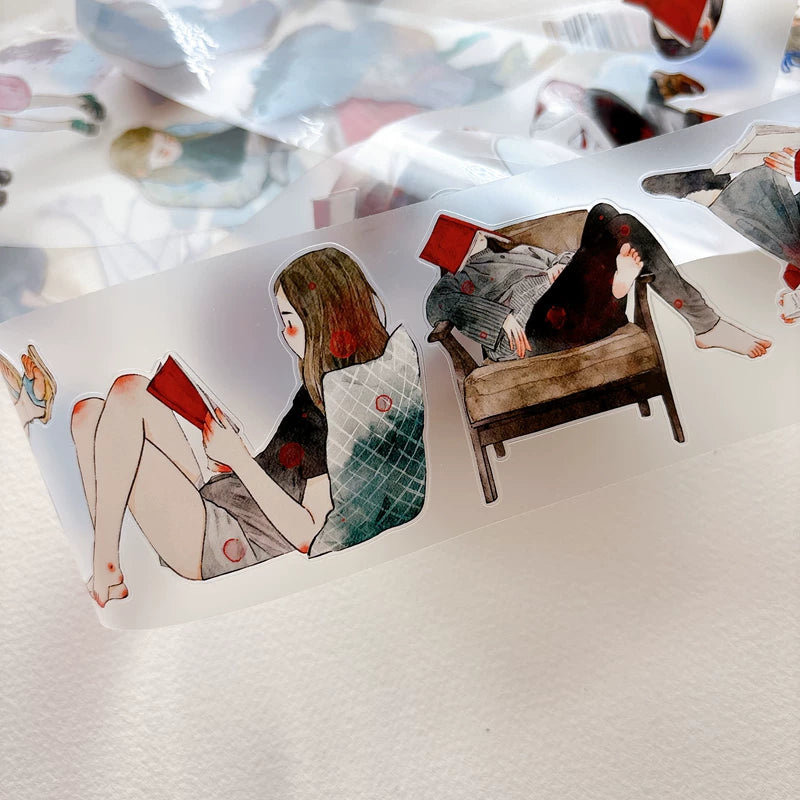 Close-up of die-cut girls reading books tape