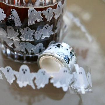 Translucent little ghost PET tape wrapped around a glass of coffee