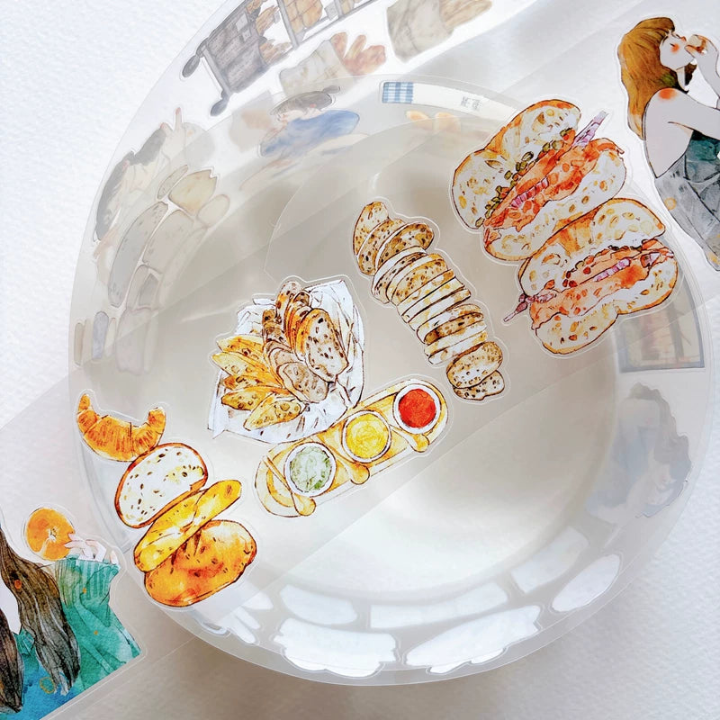 Detail of watercolor bakery girls and bread illustrations on tape