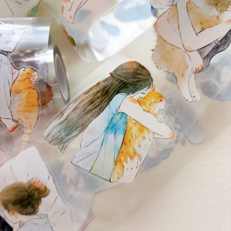 Tape roll and strips featuring girls hugging cats and dogs