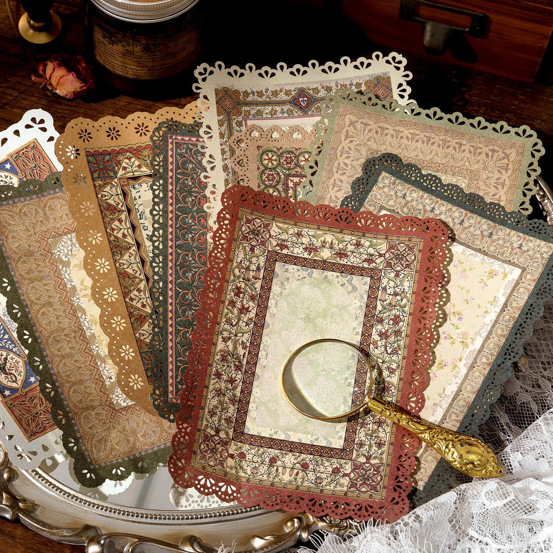 Vintage lace-edge scrapbooking paper design featuring antique lace borders and aged book-page texture