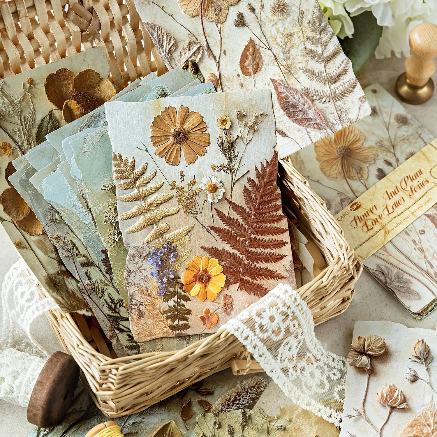 Vintage botanical relief scrapbooking paper with flower and leaf textures