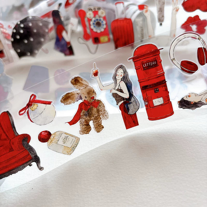 Die-cut red-themed girls and keepsakes tape pieces layered on white paper
