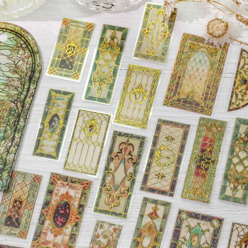 Vintage stained glass sticker pack in green and gold tones with ornate window and border pieces
