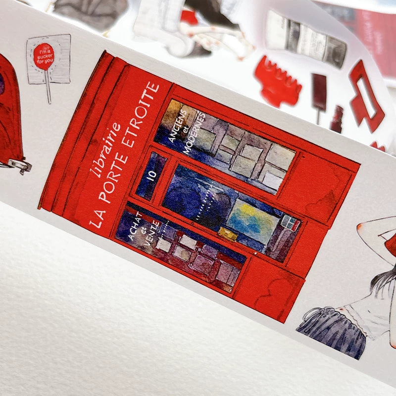 Die-cut red-themed girls and keepsakes tape pieces layered on white paper