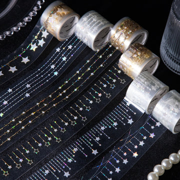 Star fairy light PET tape rolls and strips on a dark background