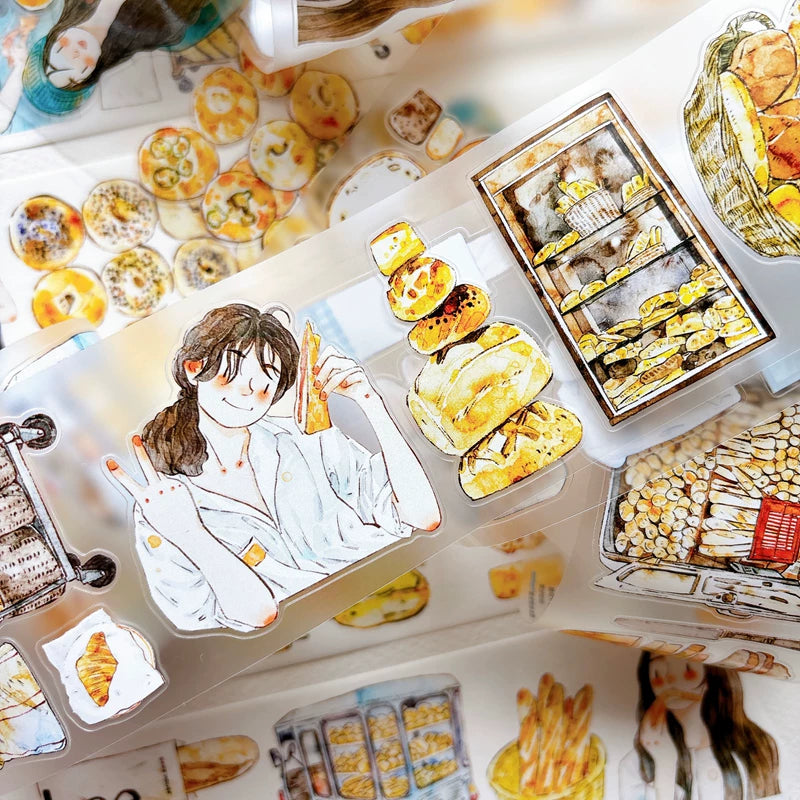 Close-up of die-cut bakery girls and bread tape