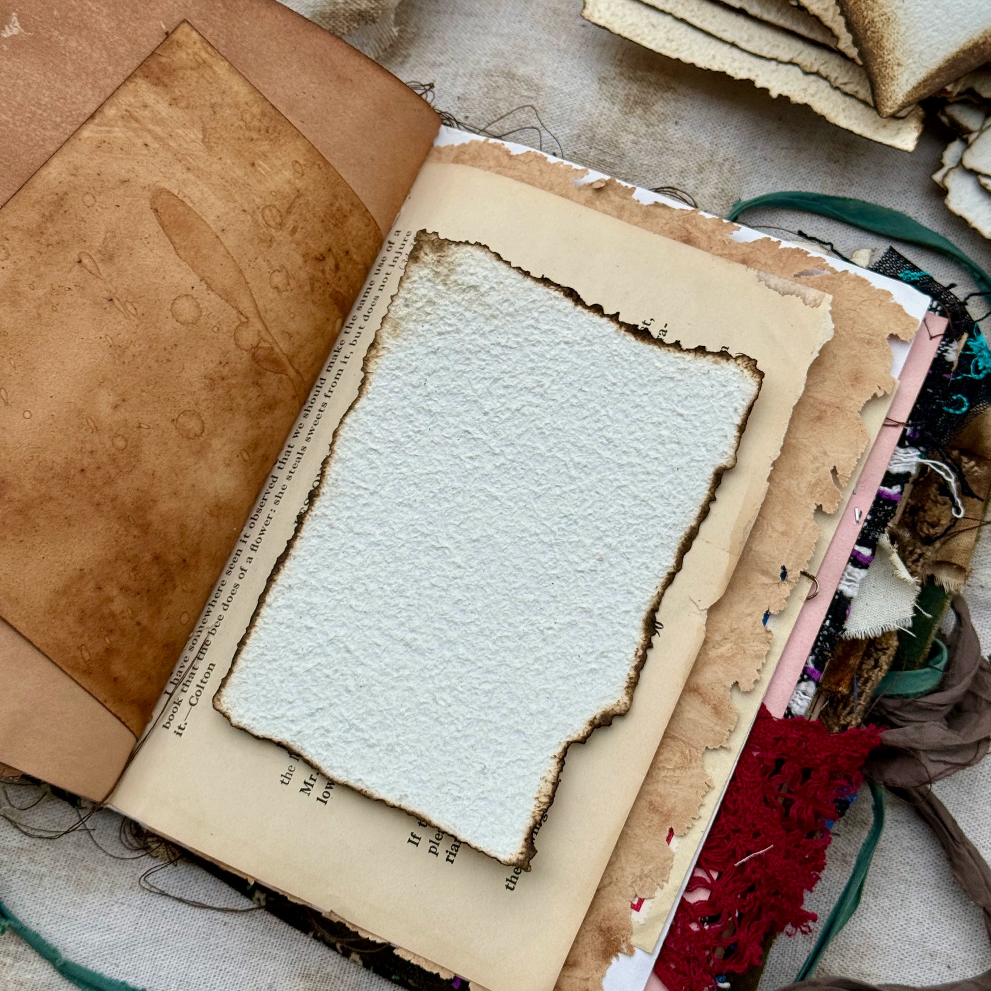 Vintage burnt edge handmade scrapbooking paper with aged neutral sheets