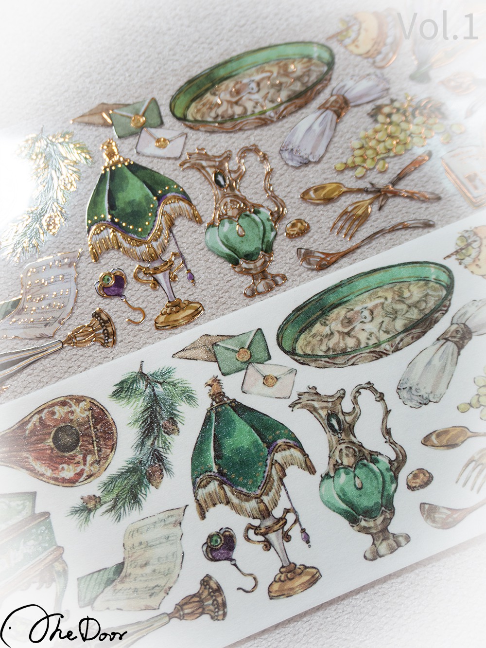 Close-up of green lamp, jug and envelope illustrations on washi tape