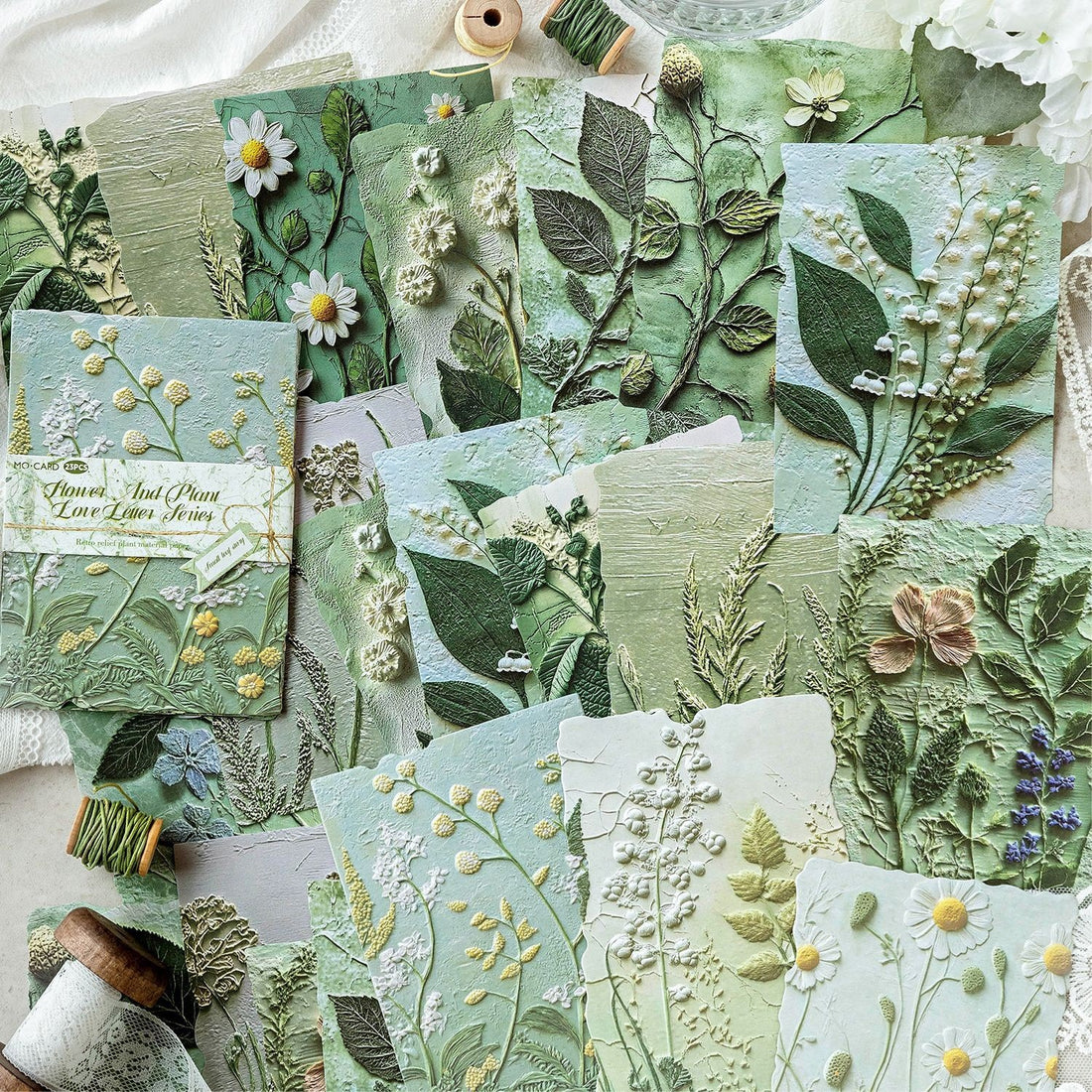 Vintage botanical relief scrapbooking paper with flower and leaf textures