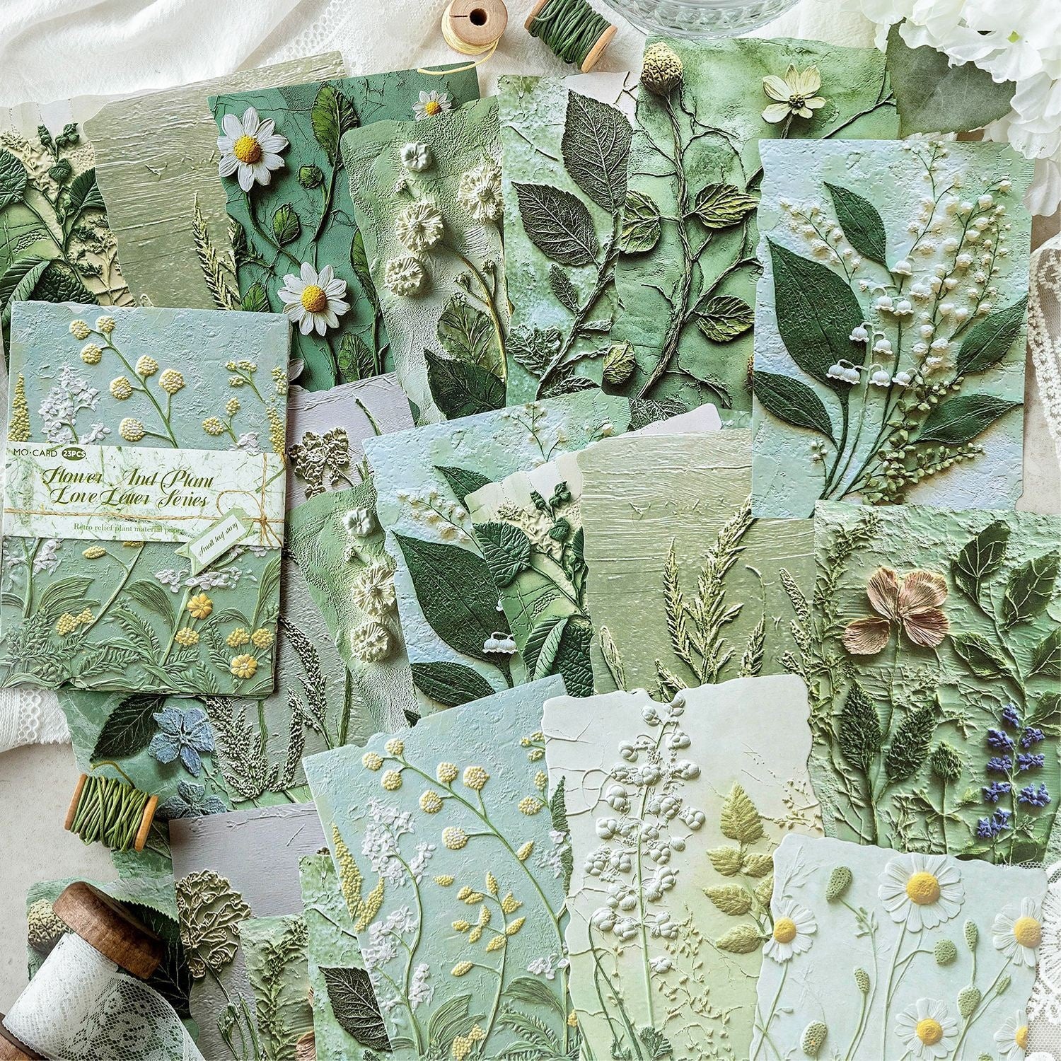 Vintage botanical relief scrapbooking paper with flower and leaf textures