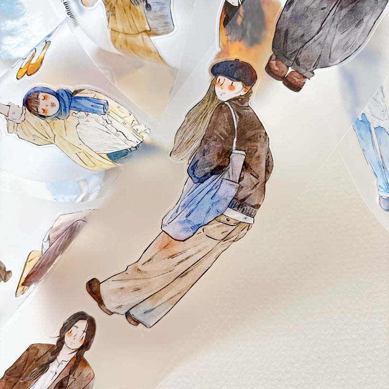 Die-cut autumn fashion girls tape pieces layered on white paper