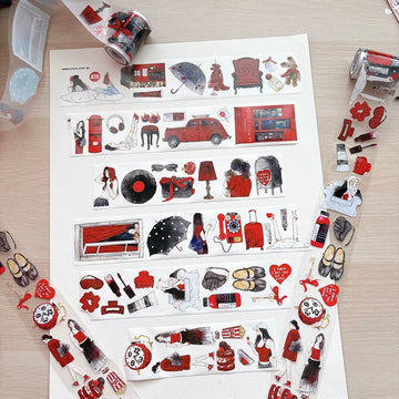 Crimson daydream tape strips laid out on paper with tape rolls