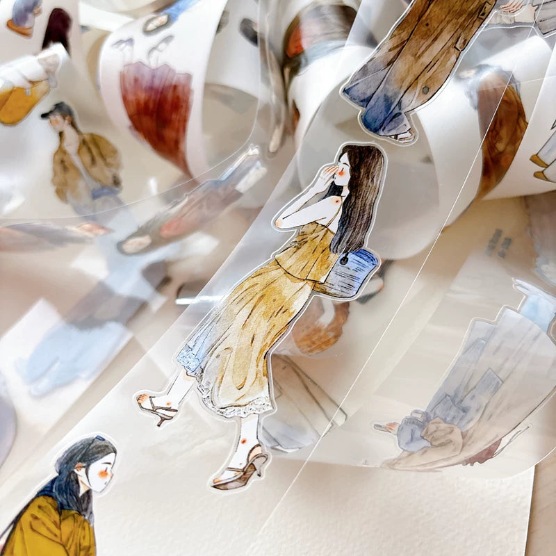 Die-cut autumn fashion girls tape pieces layered on white paper