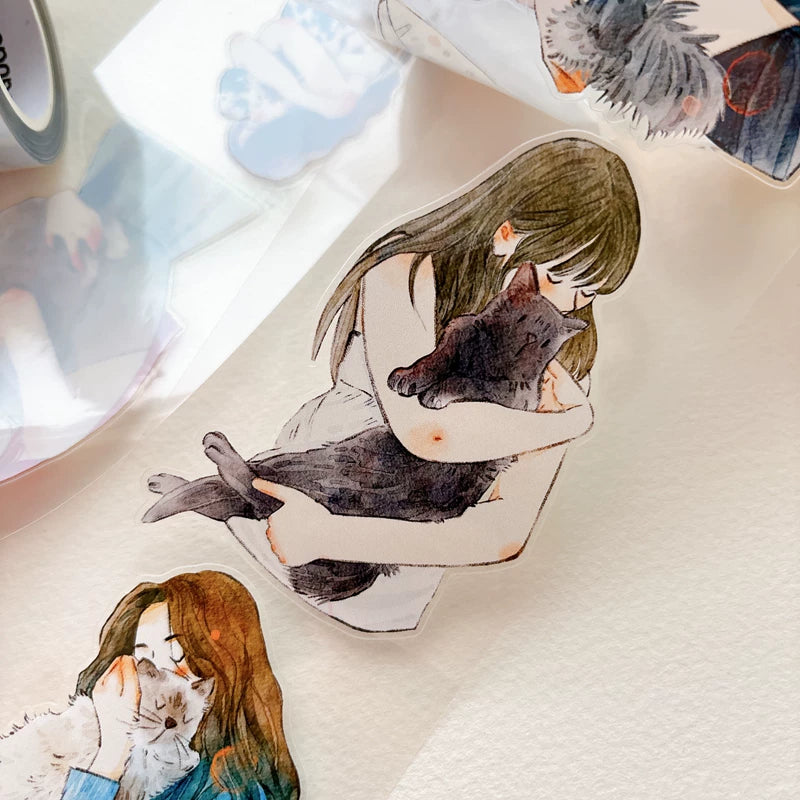 Close-up of die-cut girls hugging cats and dogs tape