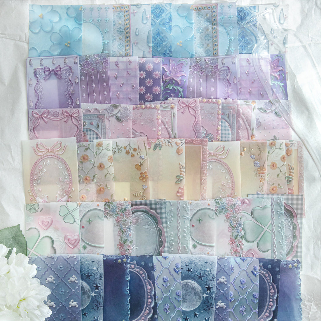 Embossed vellum scrapbooking paper with translucent decorative sheets