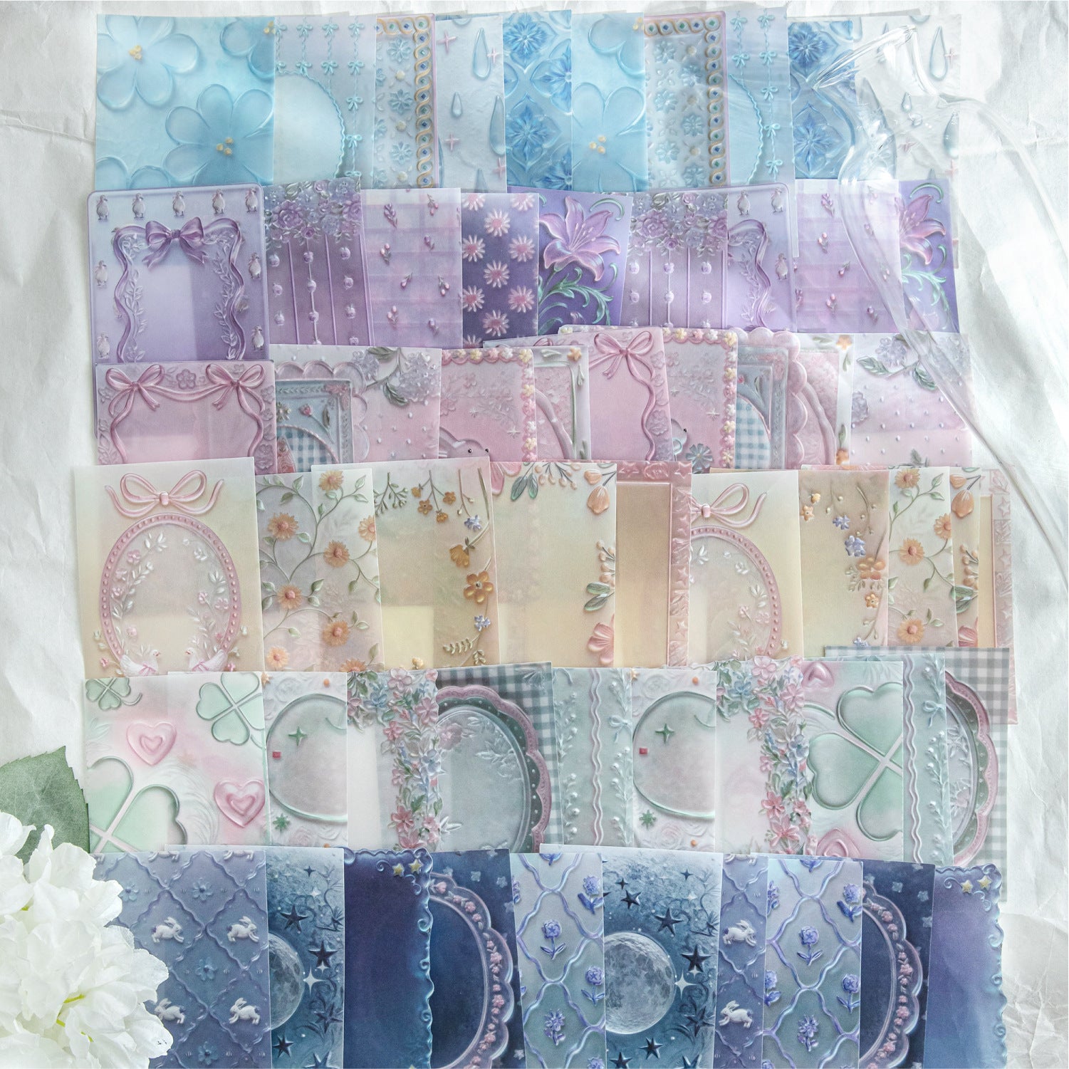 Embossed vellum scrapbooking paper with translucent decorative sheets