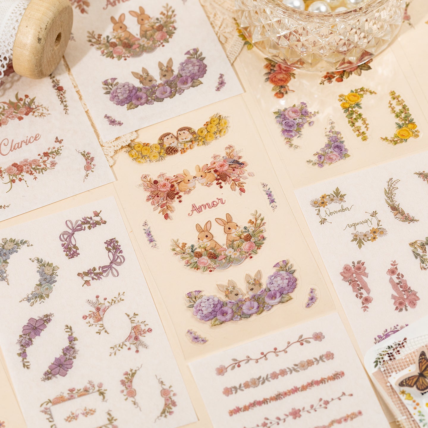 Floral embroidery frame sticker book with botanical borders, wreaths, rabbits, butterflies, ribbons, and photo frame designs