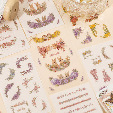 Floral embroidery frame sticker book with botanical borders, wreaths, rabbits, butterflies, ribbons, and photo frame designs