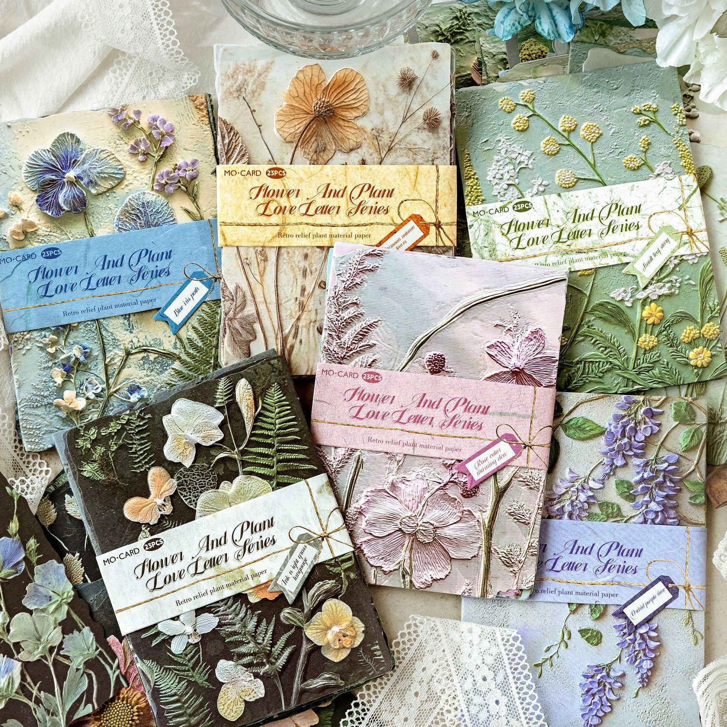 Vintage botanical relief scrapbooking paper with flower and leaf textures