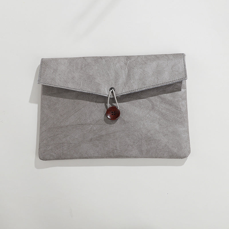 Gray textured envelope pouch with a brown button closure | Shroomi