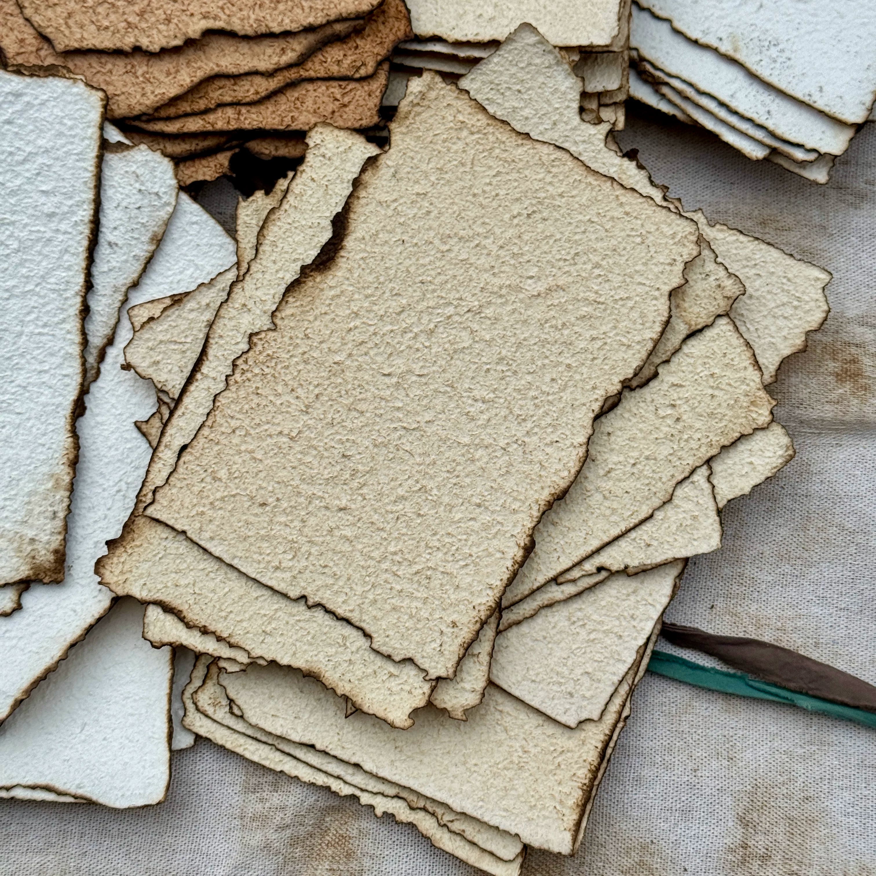 Vintage burnt edge handmade scrapbooking paper with aged neutral sheets