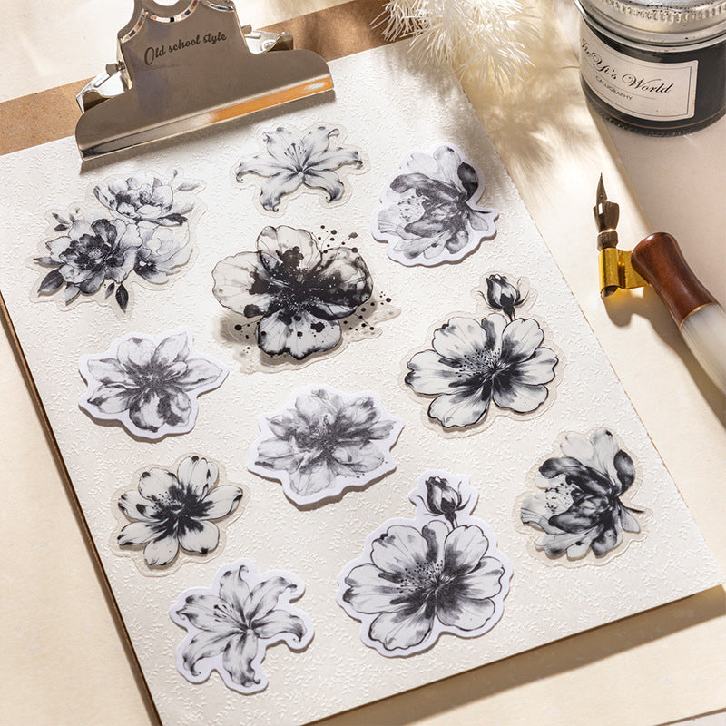 Minimalist ink-wash floral sticker design in soft monochrome tones