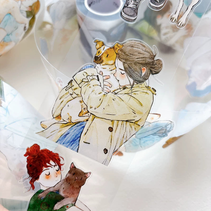 Detail of watercolor girls hugging cats and dogs illustrations on tape