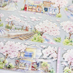 Delicate cherry blossom streets with shimmering shell-like reflections on Sakura Street Shell Shine PET Tape for crafting.