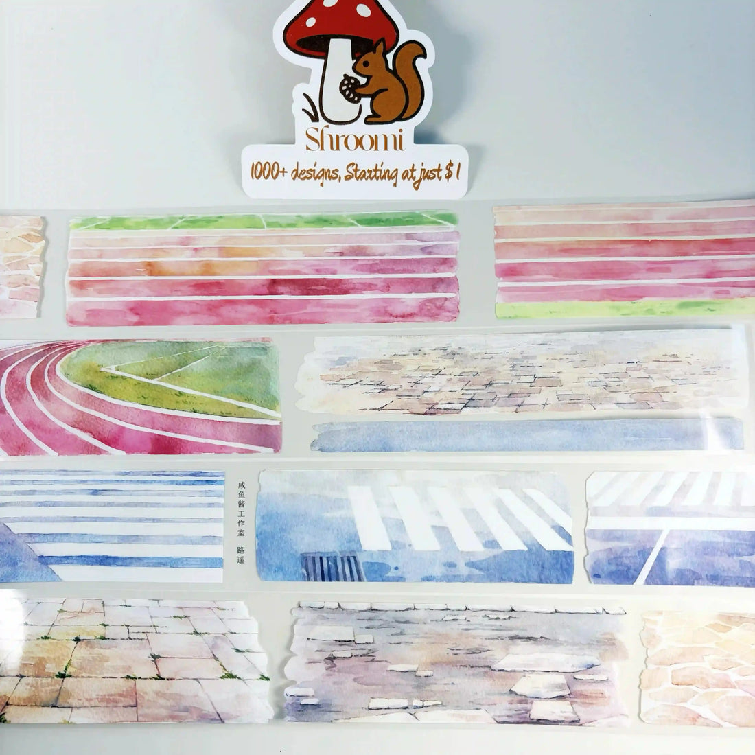 Paved Ways tape strips showing watercolor athletic track lanes, stone paving, and crosswalk textures