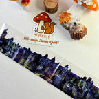 Loop 3 – PET tape showing night cityscape fragment over illustrated background