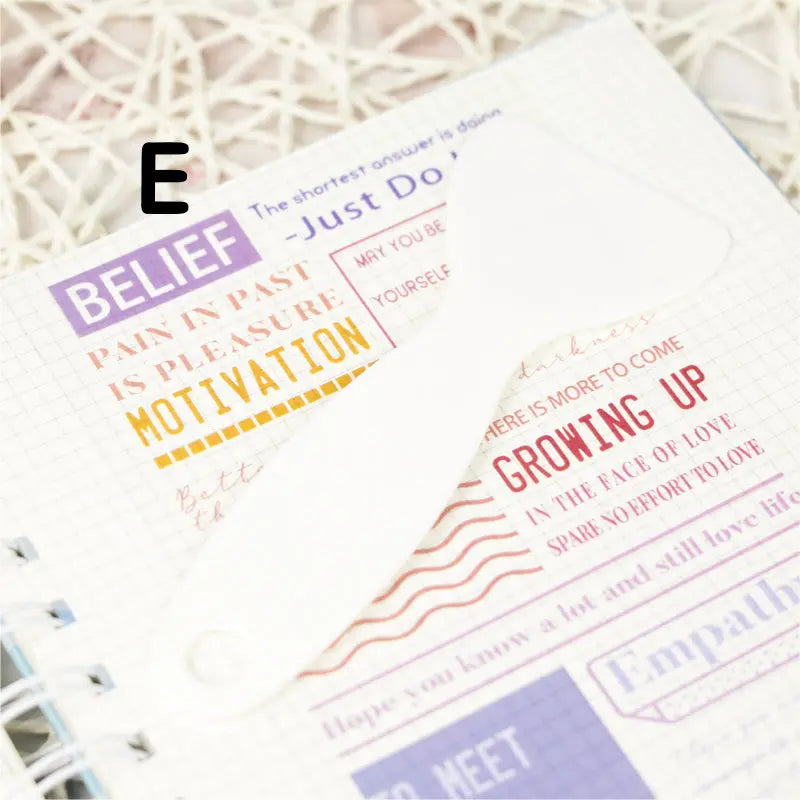 Handy plastic spatula designed for flattening stickers, ensuring a smooth, edge-free application on any surface.