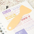 Handy plastic spatula designed to flatten stickers, ensuring a smooth, edge-free application on any surface.