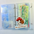 Vibrant washi tape storage album with pocket-style pages, showcasing organized pre-cut tape pieces in a neat, handy book.