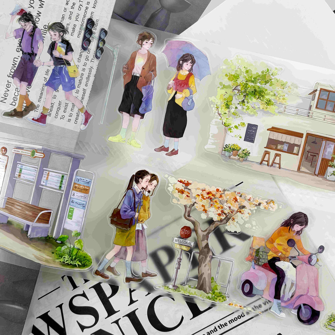 Die-cut illustrations of anime-style girls walking city streets past a bus stop, cafe storefront, and a girl riding a scooter with a dog