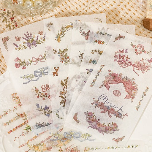 Floral embroidery frame sticker book with botanical borders, wreaths, rabbits, butterflies, ribbons, and photo frame designs