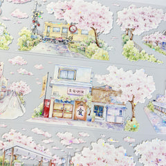 Delicate cherry blossom streets with shimmering shell-like reflections on Sakura Street Shell Shine PET Tape for crafting.