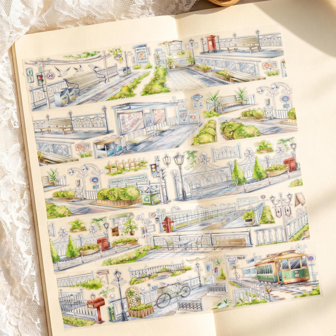 Watercolor PET tape artwork with sunlit roads, railings, benches, greenery, street signs, and a green tram