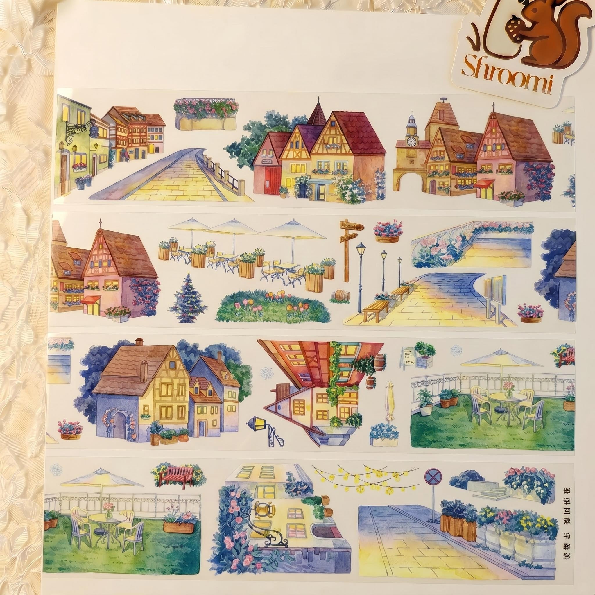 Watercolor PET tape artwork with German village streets, half-timber houses, warm lamps, benches, and terraces